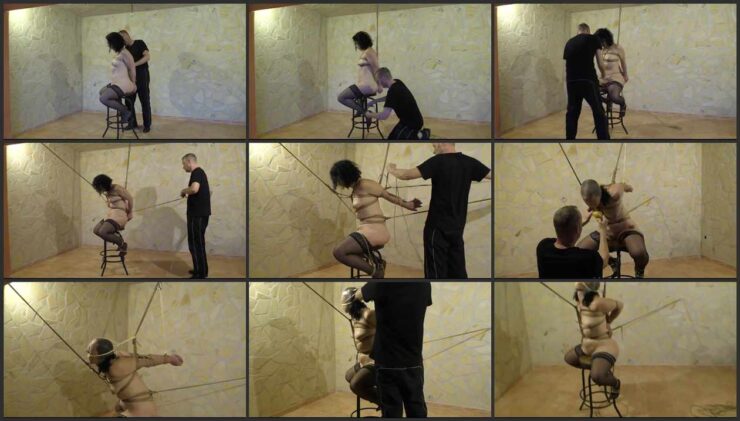Minuit on chair tied to the ceiling and sponge gagged