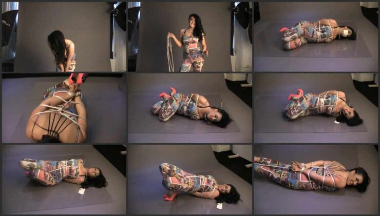 Lady B struggles like crazy is hogtied on the floor
