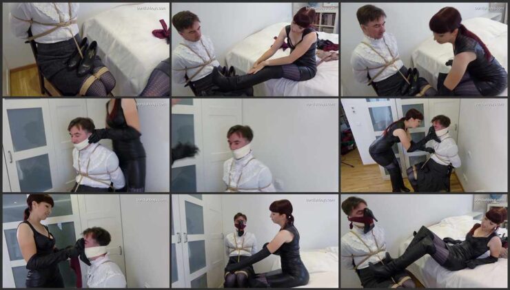 Slave is tied to a chair and gagged in high-heeled boots and worn pantyhose