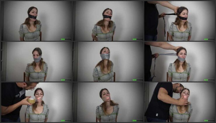 Lola Pearl with her hands tied behind her back and PVC tape on her face