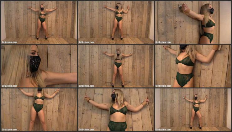 Aubrey’s arms and legs are chained to the wall for her safety