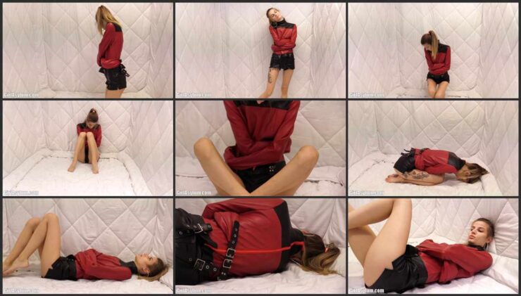 Dina in a straitjacket is imprisoned in a soft cell