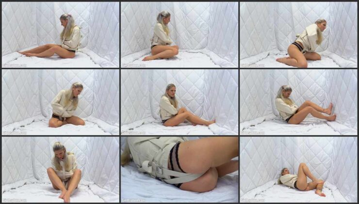 Nora Sparkle a white straitjacket
