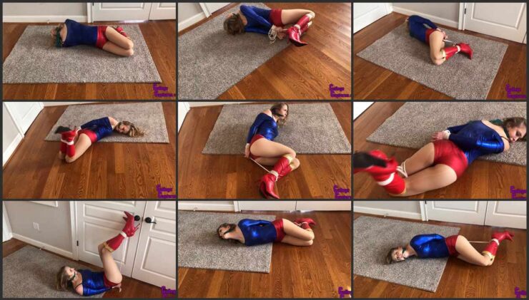 Ultra Girl (Macy Nikole) struggling get away from her captors
