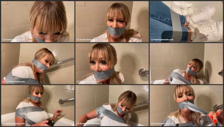 Jamie bound and wraparound tape gagged in the bathroom