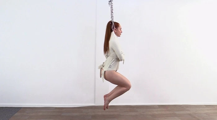 Suspended straitjacket bondage