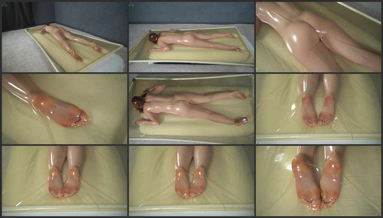 butt-up-in-a-clear-latex-bed-and-foot-fetish-extreme-bondage-video