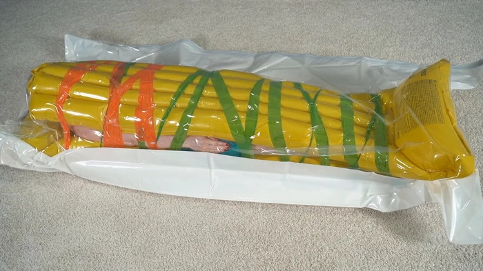 Two yellow mattresses and a duct tape bondage