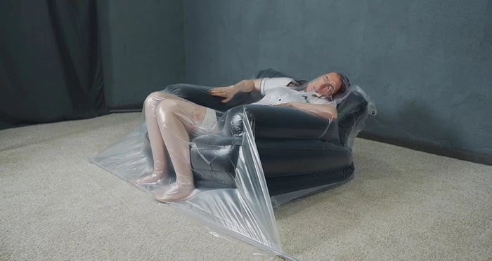 Inflatable chair and vacuuming schoolgirl Sonya