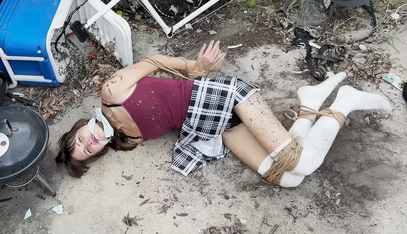 Zura continues her escape attempt fully restrained and gagged