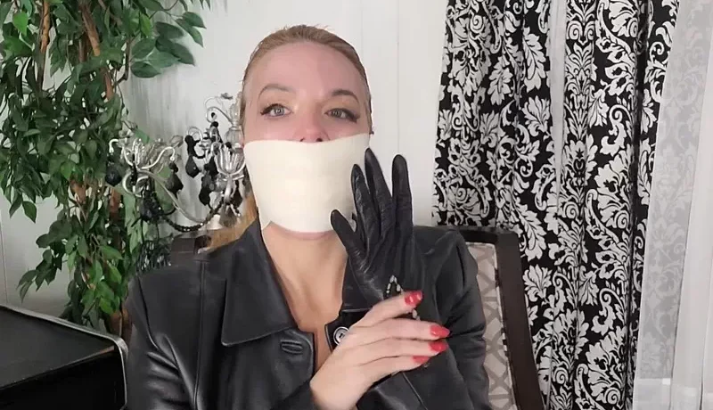 Leather lady JJ is gagged, gloved and awaiting your arrival