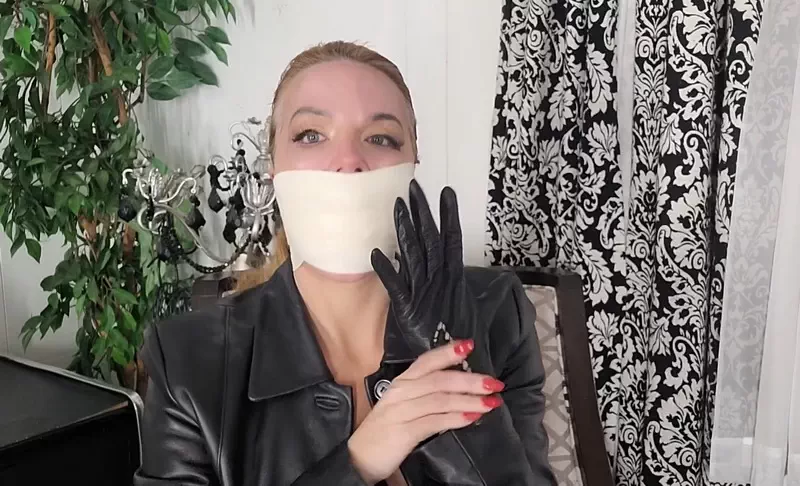 Leather lady JJ is gagged, gloved and awaiting your arrival