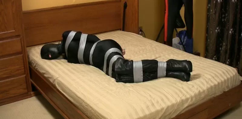 Overwhelms the senses in a hooded and taped