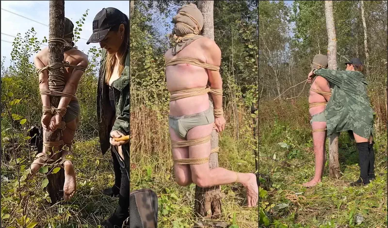 The Mistress teases the male slave tied to a tree and leaves him alone