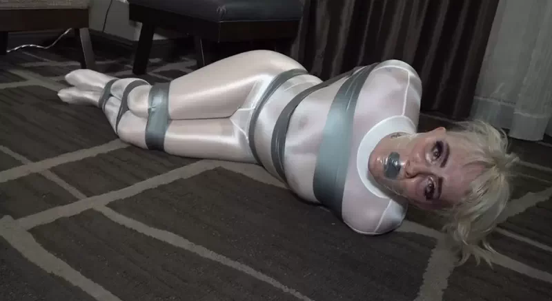 Bound and gagged in a white catsuit