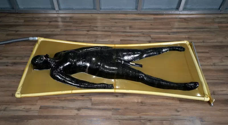 The symbiote envelops the maid and penetrates the vacuum bed