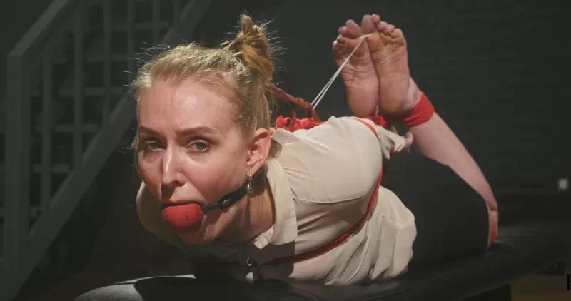 The Secretary in Tight Hogtie with Red Ropes and Huge BallGag