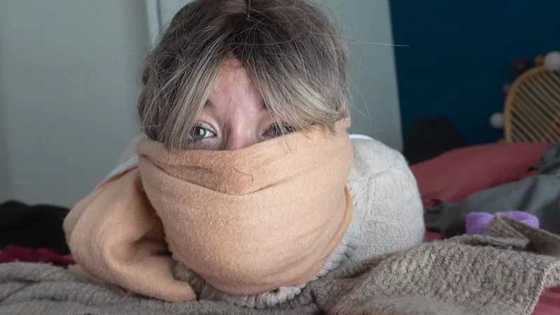 A Housewife Tied Up And Gagged Amidst Her Clothes