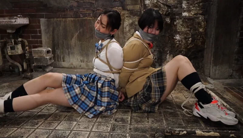 Two naive schoolgirls take a shortcut through an underground tunnel