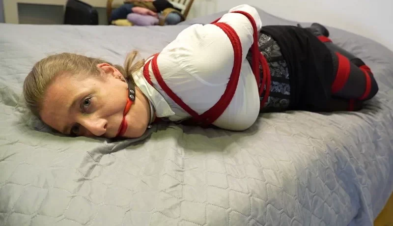 Dina bound and ballgagged in boots