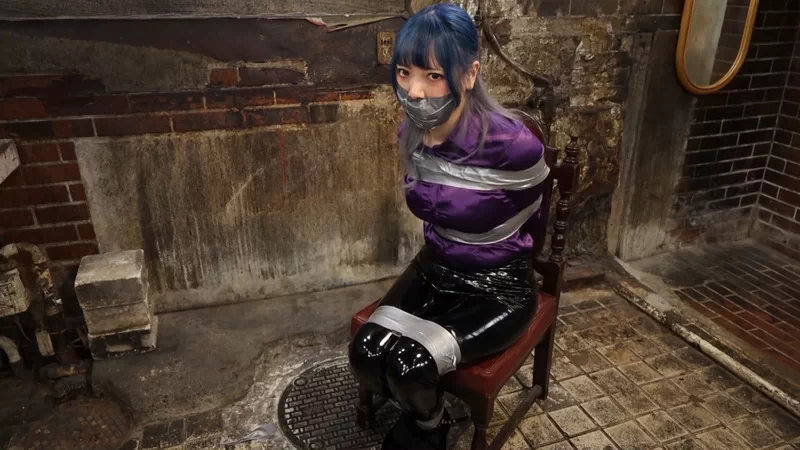 Detective Yui humiliated in tight tape bondage, stuffed mouth and gagged